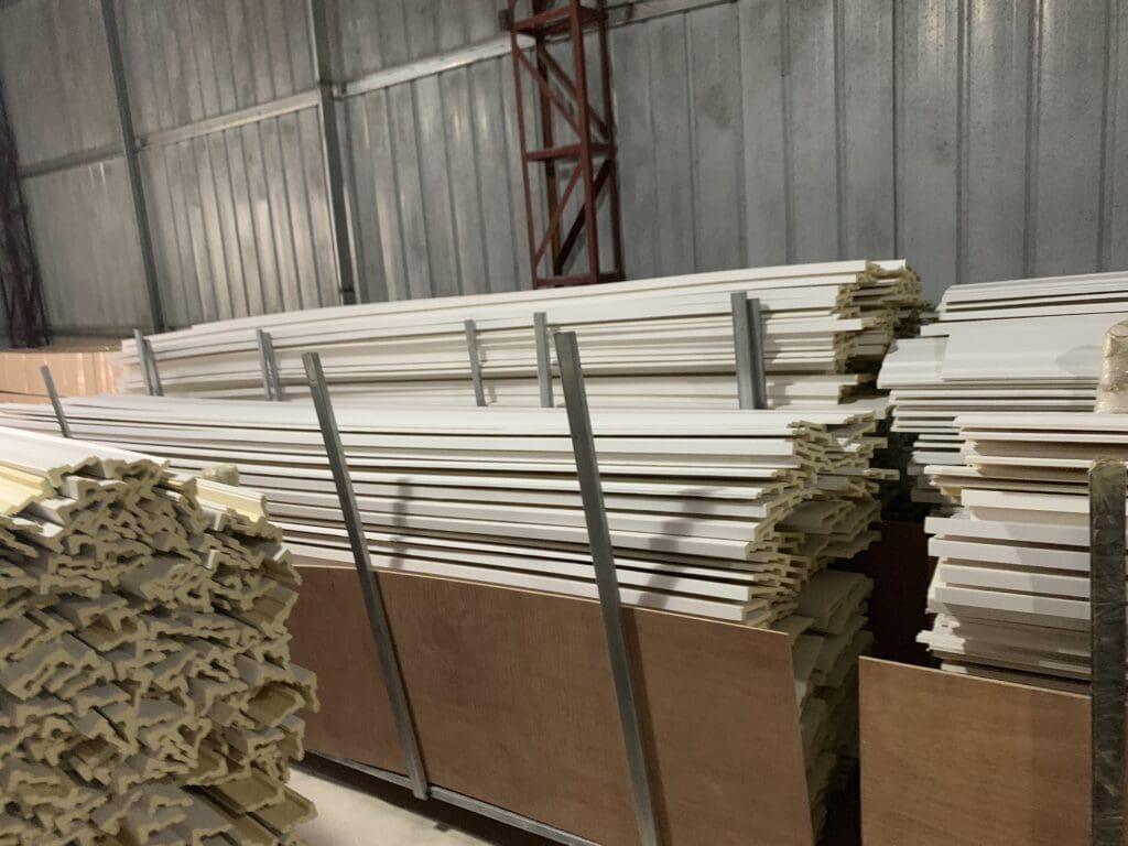 A warehouse filled with lots of wooden boards.