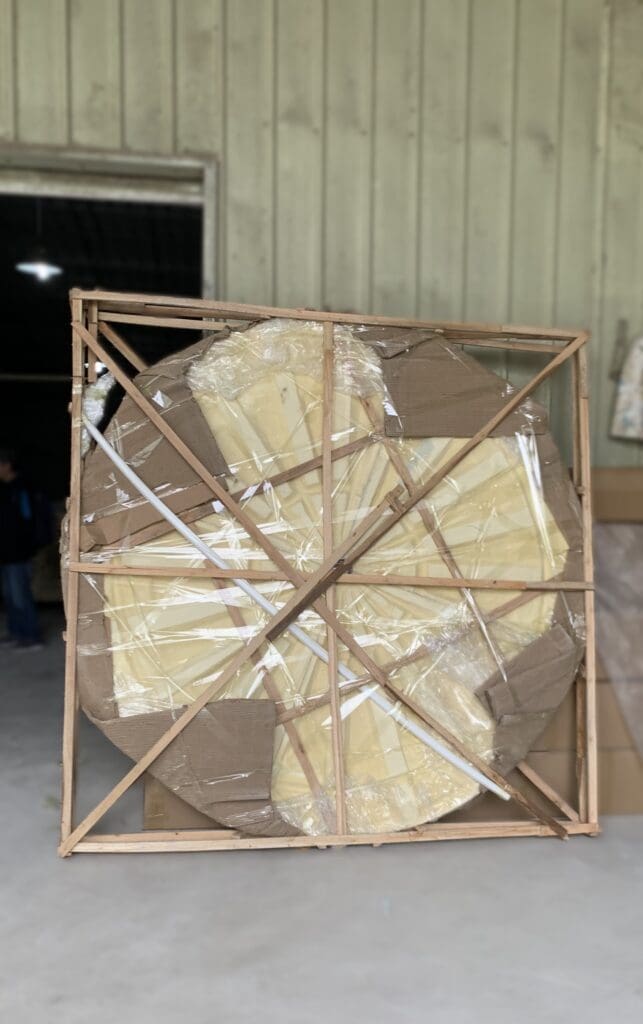 A wooden frame with some white paper wrapped around it
