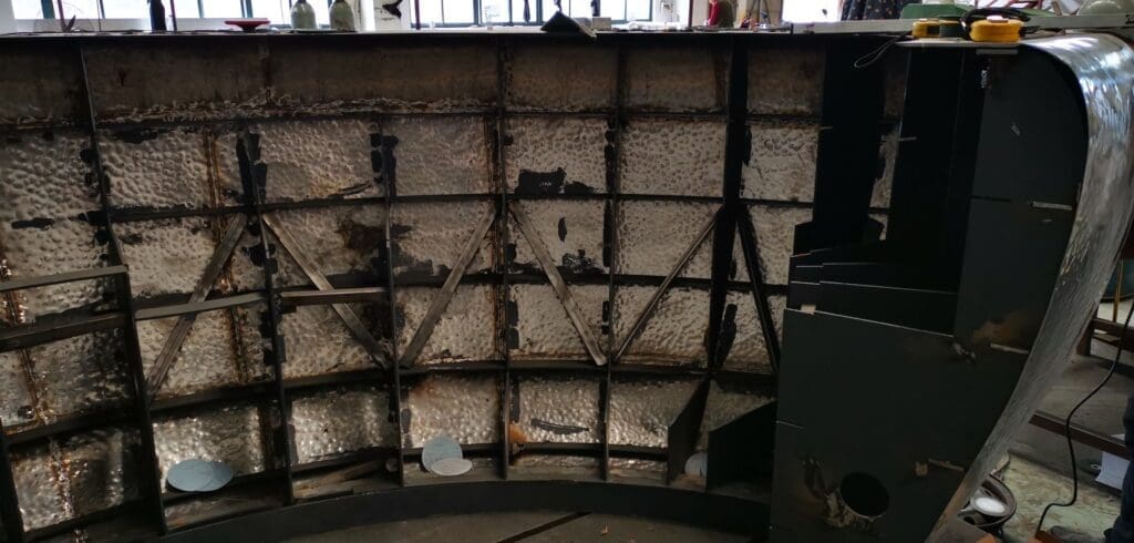 A wall with some metal bars on it