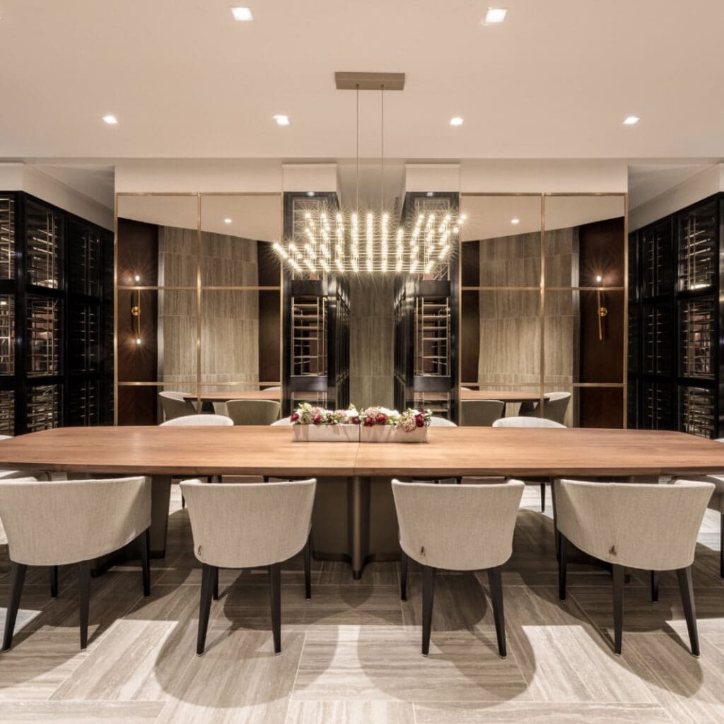 A large dining room table with chairs around it.