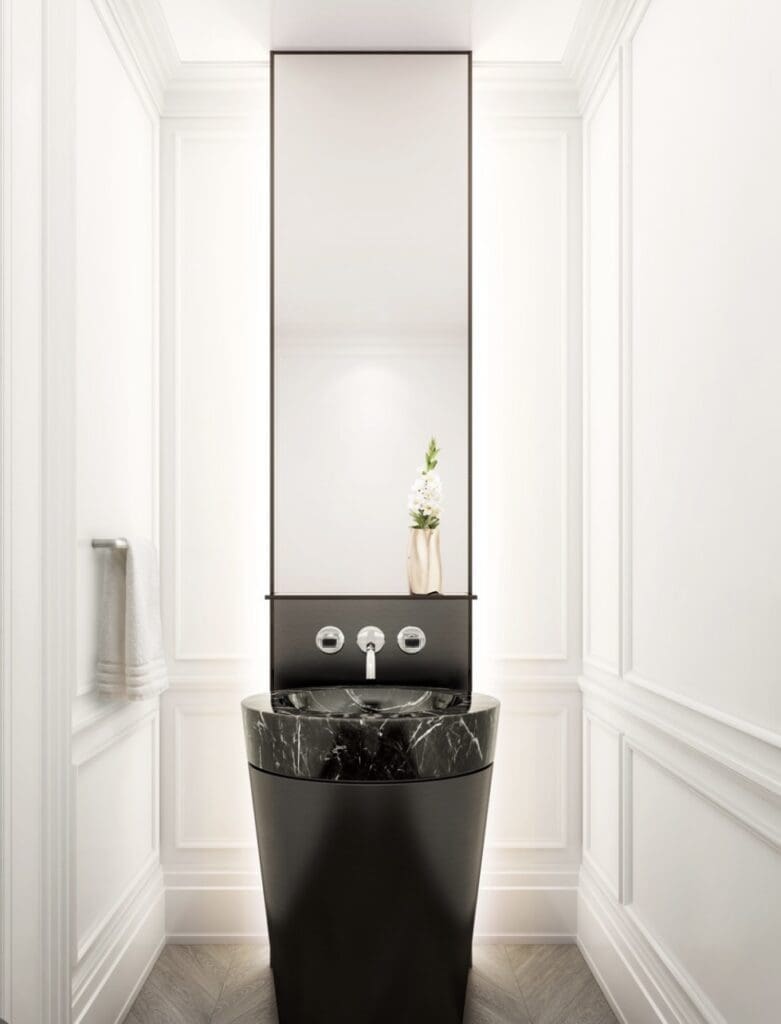 A bathroom with a sink and mirror in it