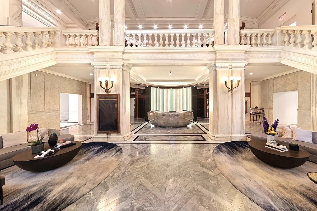 A large room with marble floors and walls.