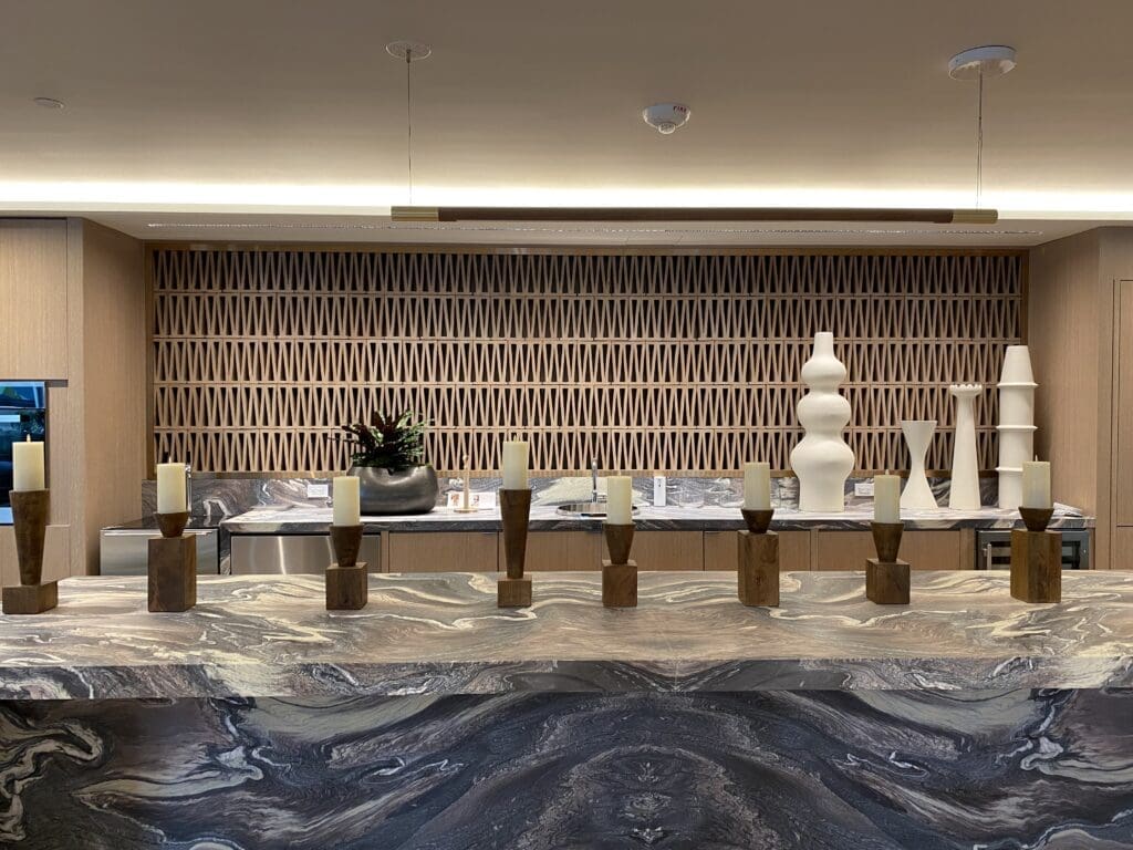 A room with many vases on the counter